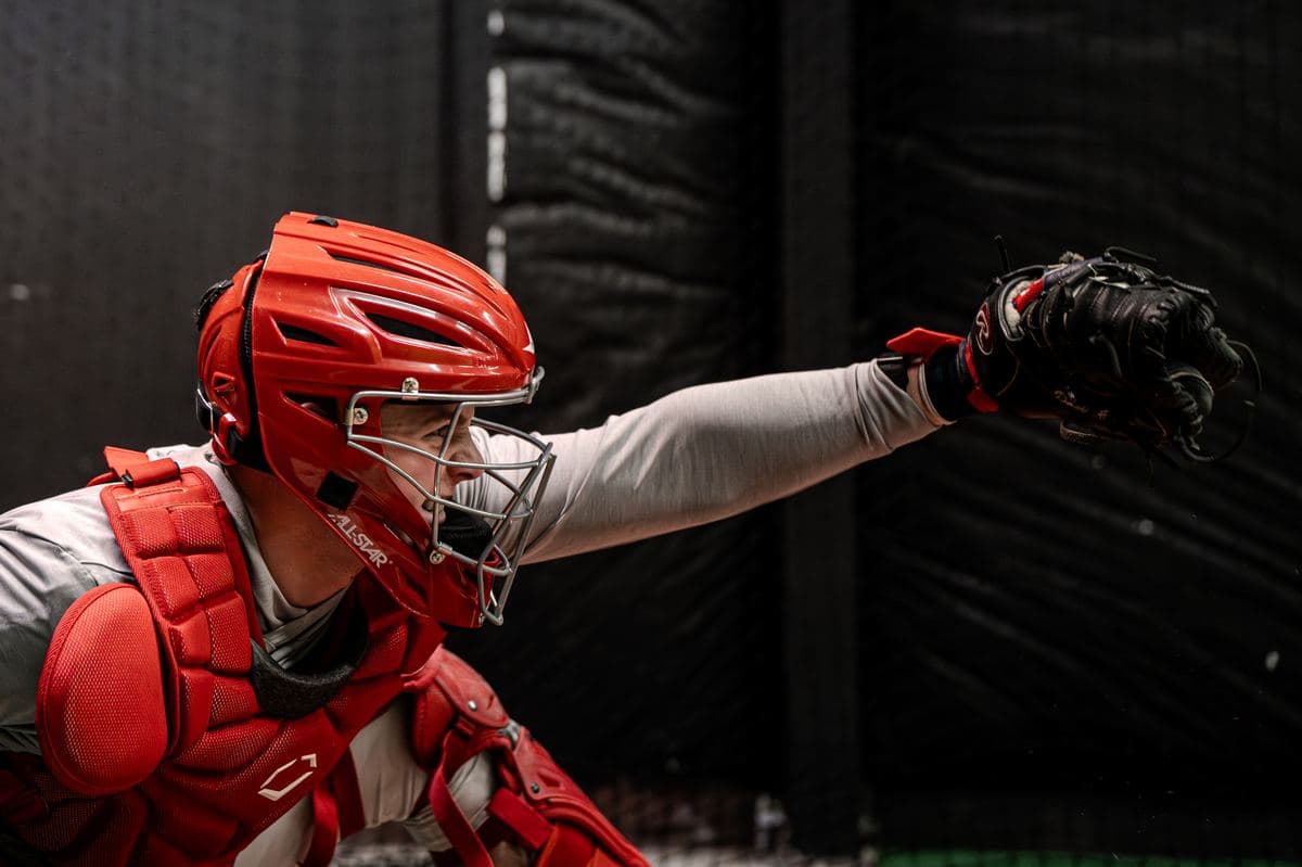 A catcher receiving a pitch in the PPL cage